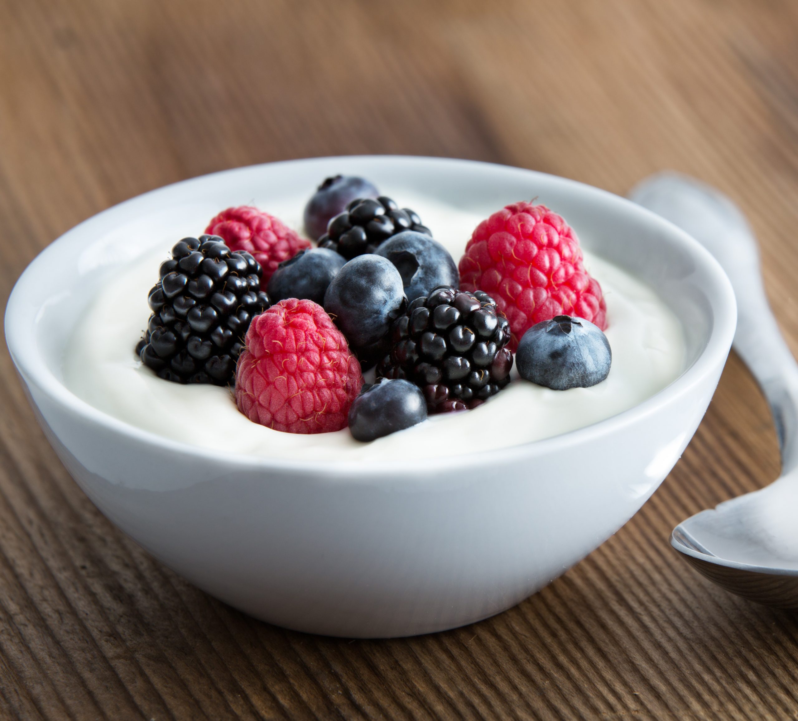 Bowl of high protein yogurt with berries